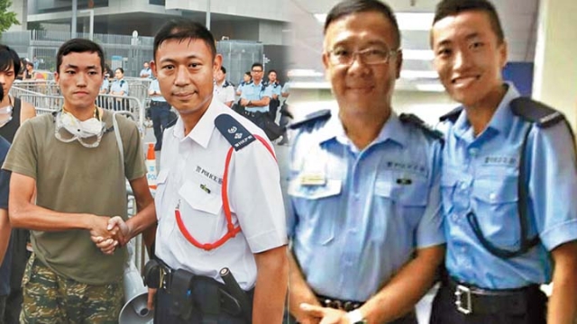 Joe Yeung, a former auxiliary police, shook hands with a police officer during the occupy protest.