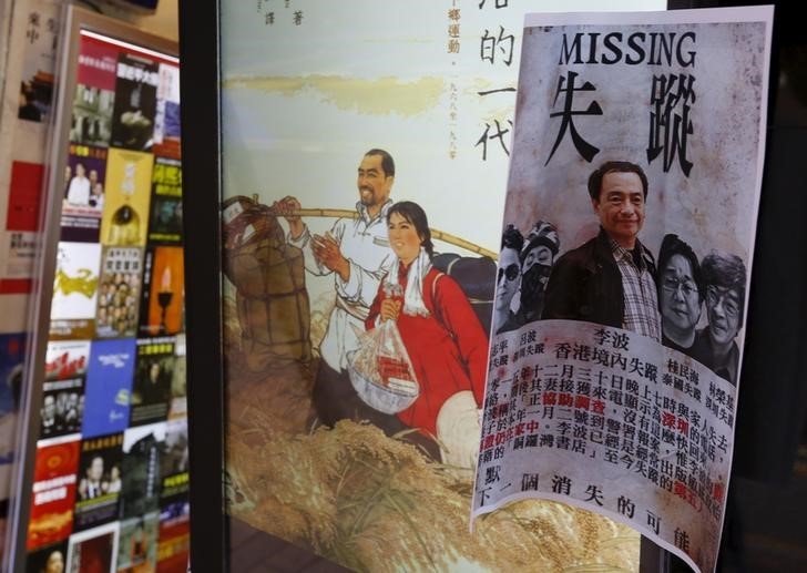 A printout showing Lee Bo, specializing in publications critical of China, and four other colleagues who went missing, is displayed outside a bookstore at Causeway Bay shopping district in Hong Kong, China January 6, 2016.   Photo: Reuters/Bobby Yip.