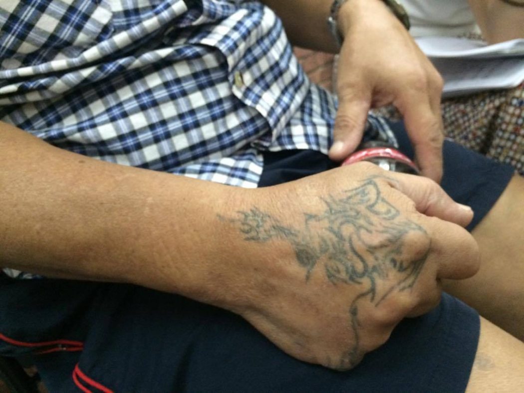 Chan's faded tattoos. Photo: HKFP / Ellie Ng