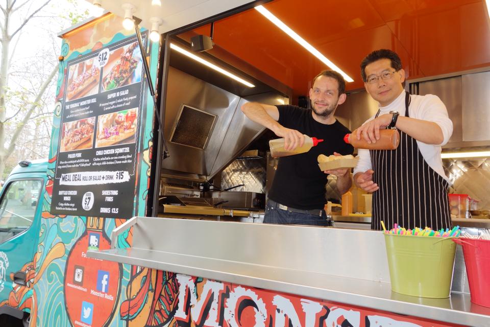 Gregory So (right) visiting a food truck in Australia in August.