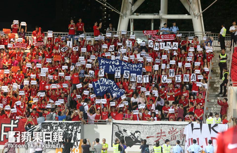 Hong Kong fans with “BOO” papers at the November 2015 match. 