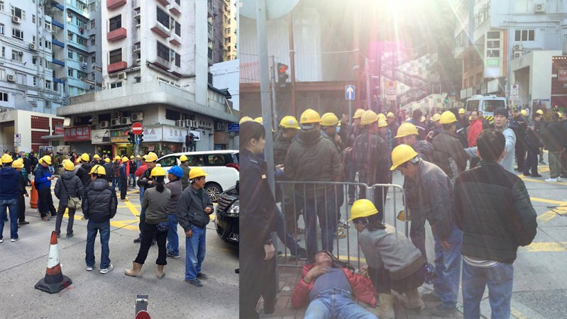 Around 50 construction workers have occupied a road in Fortress Hill in protest over unpaid wages.