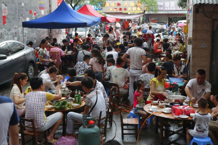 People eating at Yulin Dog Meat Festival