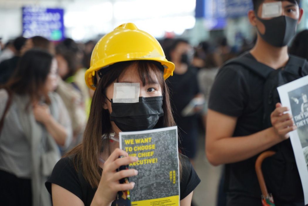 August 12 extradition protester eye protest