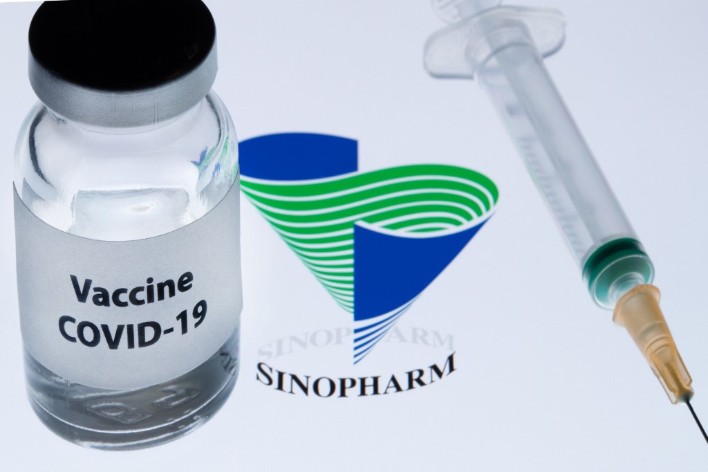 China has granted "conditional" market approval to a Sinopharm vaccine with a reported 79 percent efficacy rate against Covid-19, health authorities said Thursday, a major stride towards inoculating the world's largest population.  The Sinopharm jab, which has surged ahead of a raft of Chinese competitors during Phase 3 trials, could signal a breakthrough in the battle to squash the pandemic in Asia.  Around 4.5 million doses of largely unproven emergency vaccines made locally have already been given to health workers and other workers destined for overseas jobs, according to authorities.  On Wednesday, Sinopharm announced its leading candidate had a 79.34 percent efficacy rate.  That is lower than rival jabs developed in the West by Pfizer-BioNTech and Moderna -- with 95 and 94 percent rates respectively -- but still a game-changer for China.  Chen Shifei, deputy commissioner of the National Medical Products Administration, on Thursday told reporters his agency had granted a "conditional listing" to Sinopharm's vaccine.   A conditional listing helps hustle emergency drugs to market in cases when clinical trials are yet to meet normal standards but indicate they will work.  "The known benefits of Sinopharm's new inactivated coronavirus vaccine are bigger than the known and potential risks," Chen added.   The listing allows the government to "extend vaccination to high-risk groups, those susceptible to a severe viral infection... and the elderly," Zeng Yixin, Vice Minister of the National Health Commission told reporters.  But China faces the unprecedented challenge of getting vaccines to a population of more than 1.3 billion people.  "The general view is you have to vaccinate 60 to 70 percent to establish universal protection," Zeng added.  Beijing plans to vaccinate millions this winter in the run-up to Lunar New Year.   "I'm convinced -- and please be convinced -- that the production of Covid-19 vaccines can meet the demand of large-scale vaccination we have in China," Mao Junfeng, head of Consumer Goods Industry Department added.  China has also pledged to swiftly share its vaccines with lesser developed countries at a "fair price", as it seeks global leadership in the recovery from a pandemic which first emerged in the central Chinese city of Wuhan a year ago.  As a winter wave of virus infections batters much of the world, spurring fresh lockdowns and grim spikes in death tolls, attention has returned to China's management of the pandemic.  China has broadly stamped out the virus inside its borders, introducing swift local lockdowns and mass testing when cases emerge.   Beijing has been at pains to retool the pandemic story in its favour, touting the fast reflexes of its Communist leadership in locking down the country and restarting the economy.  China is forecast to be the only major economy to post positive growth this year.  But it has been heavily criticised for closing down discussion and reporting that questions the official narrative.  On Monday a Shanghai court jailed citizen journalist Zhang Zhan for four years for her reporting from Wuhan during the early months of the pandemic.