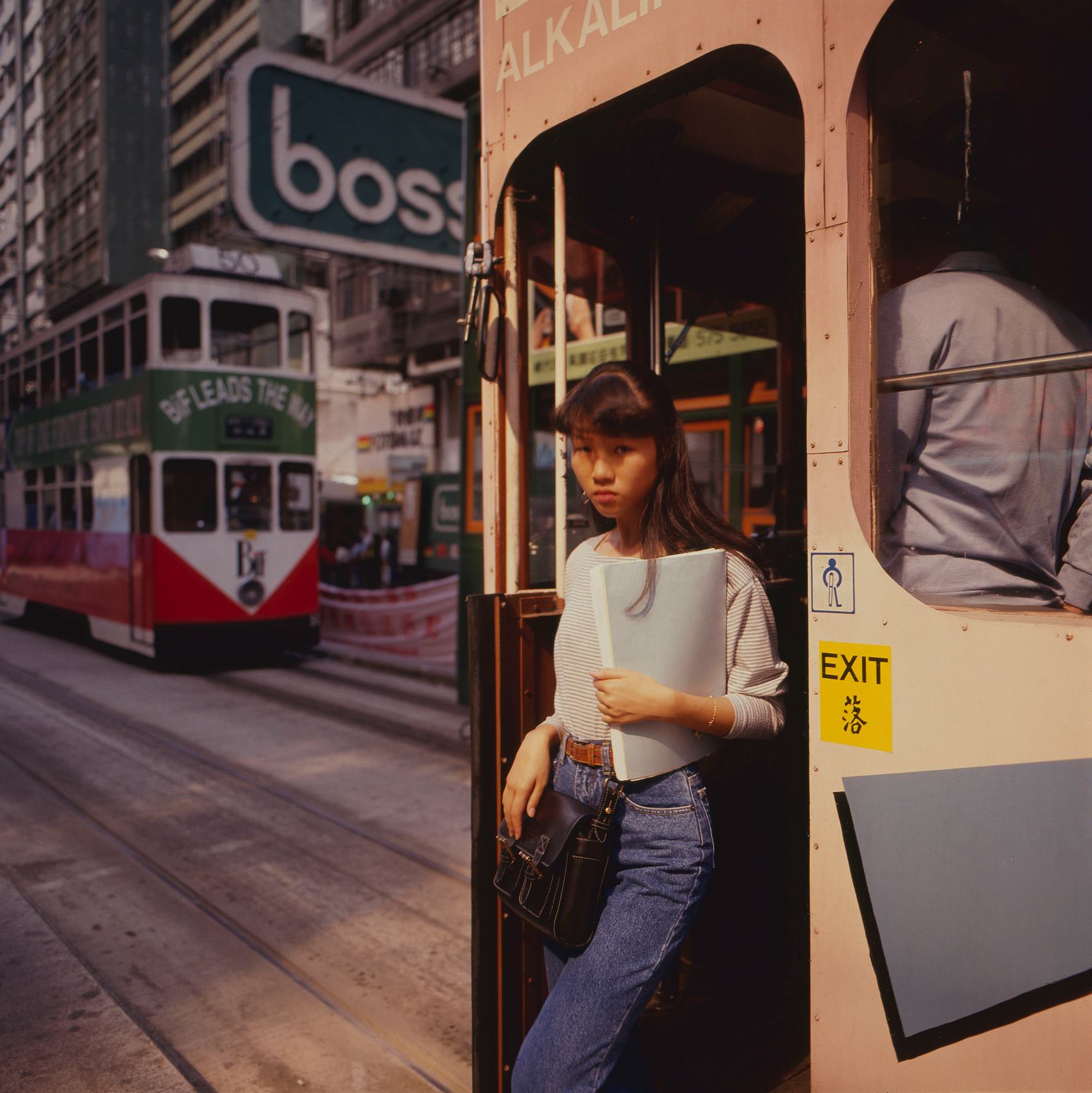 Woman getting off tram, Central, Hong Kong 1990