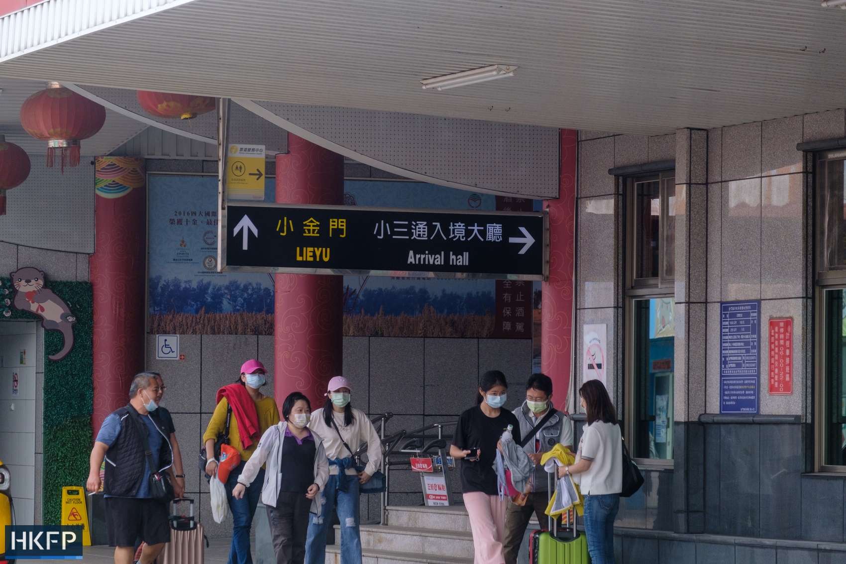 People arriving to Kinmen from Xiao Kinmen after leaving the ferry, Kinmen, Taiwan. November 20, 2021. Photo: Walid Berrazeg/HKFP.