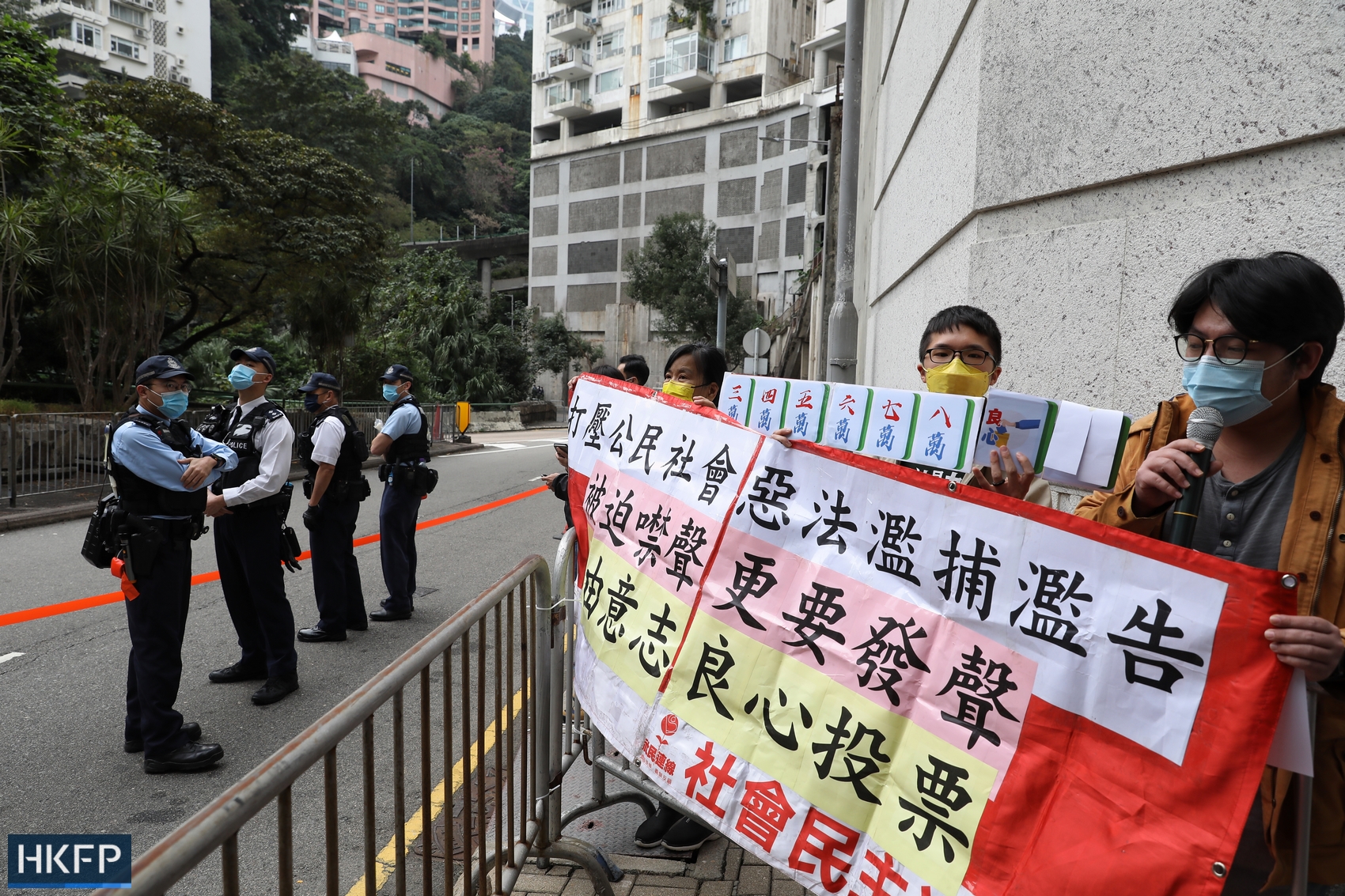 2021 Legco election: Members of the League of Social Democrat, including Chan Po-ying, led a four-person protest near Raimondi College as the chief executive casted her ballot. Photo: Kyle Lam/HKFP.