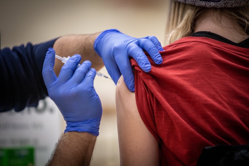A student receiving Covid-19 vaccine.