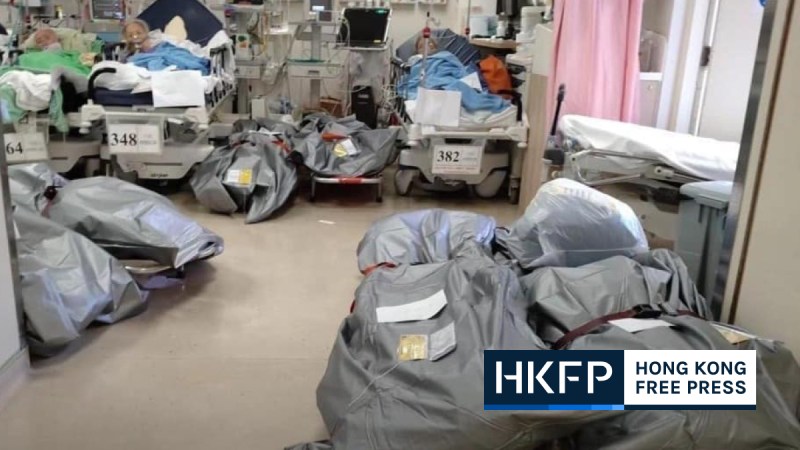 Covid-19 - photos of body bags next to patients in public hospital