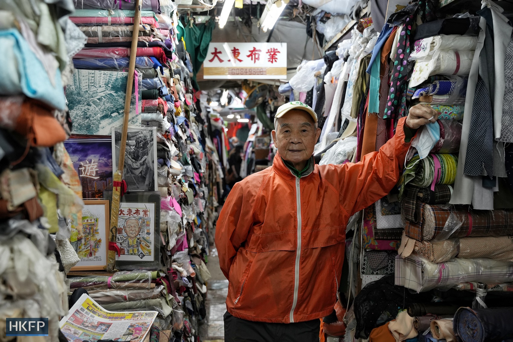 Fabric seller Uncle Tung, 90, at Yen Chow Street Hawker Bazaar in Sham Shui Po, Hong Kong, on December 29, 2022. Photo: Kyle Lam/HKFP.