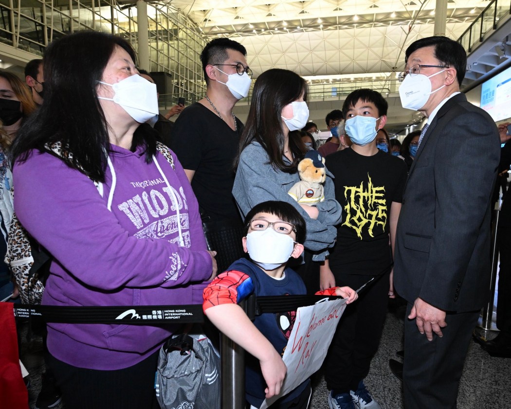 Chief Executive John Lee talks with relatives of the Hong Kong search and rescue team after their return from Turkey on February 18, 2023. Photo: GovHK.