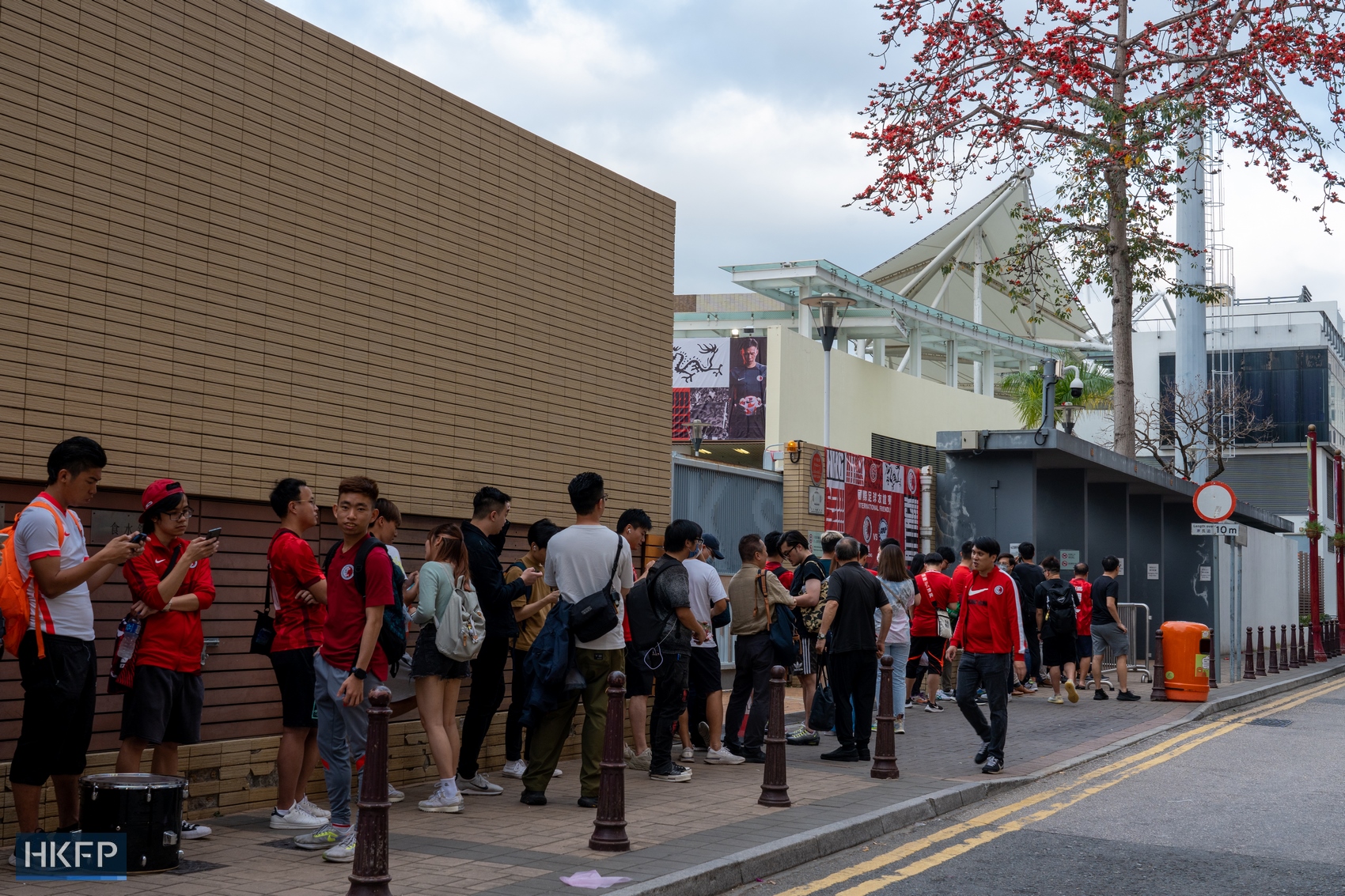 Fans queuing outside the Mong Kok Stadium for an international friendly football match between Hong Kong and Singapore on March 23, 2023.