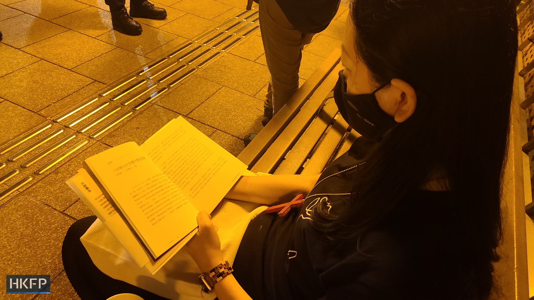 A woman reads "May 35" by playwright Candace Chong in Victoria Park, in Causeway Bay, Hong Kong, on June 4 2023. Photo: Mandy Cheng/HKFP.