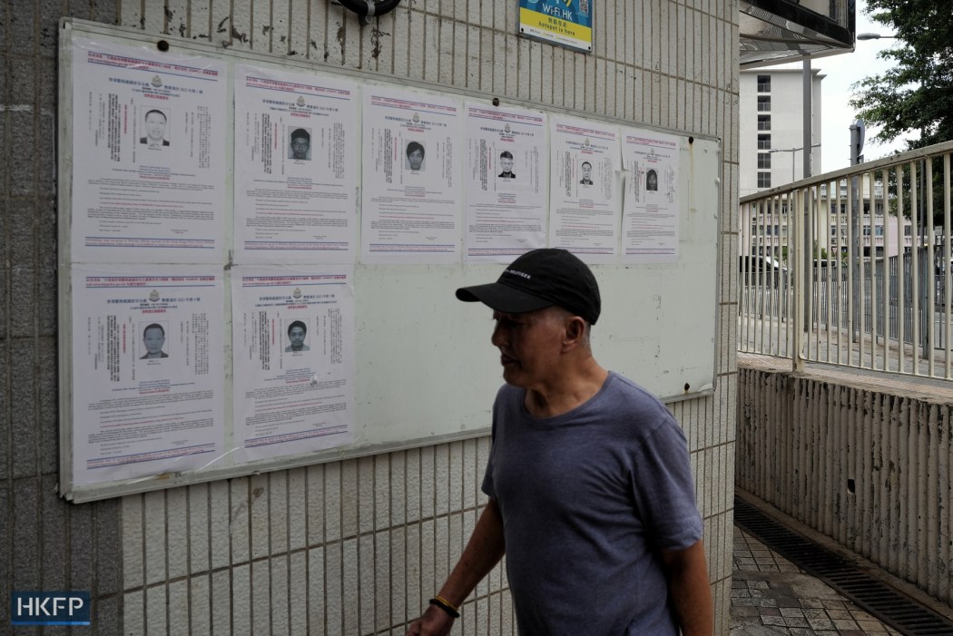 The posters about the eight democrats wanted by the national security police on a notice board