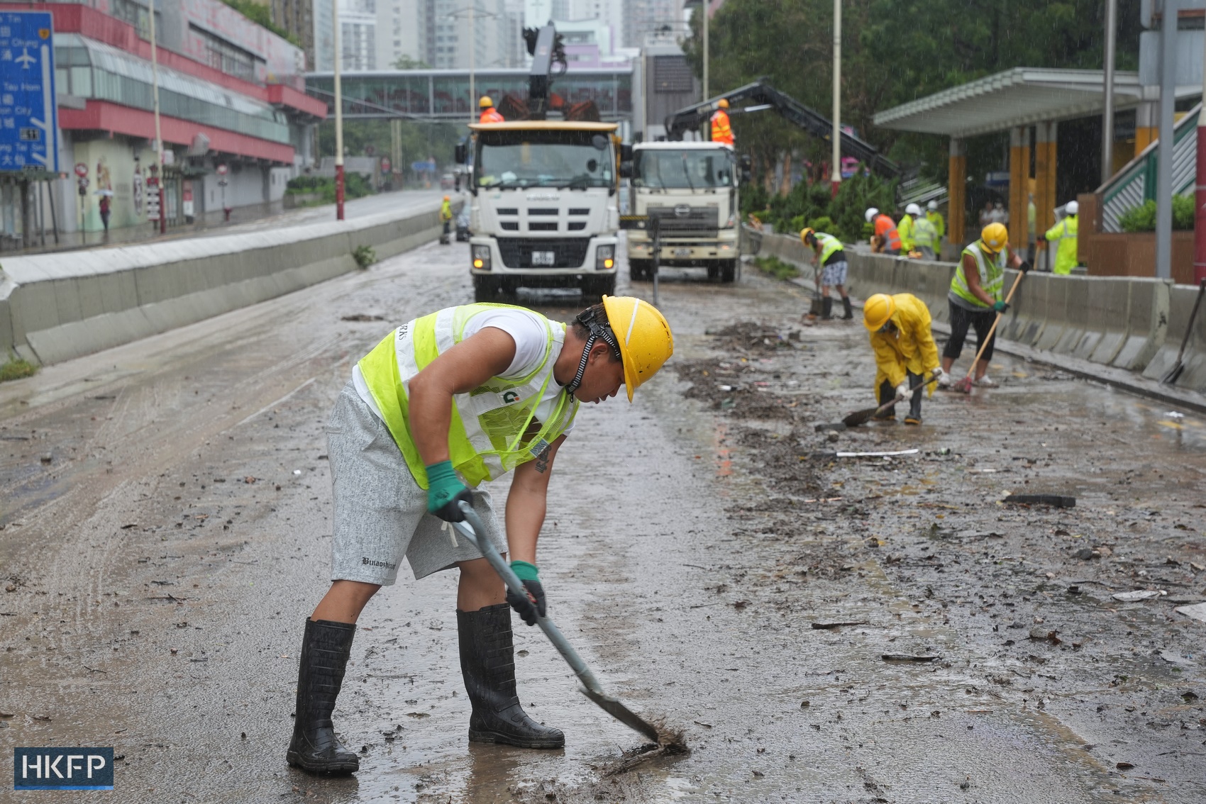 Workers clear debris from the roads in Wong Tai Sin on September 8, 2023, after the area was hit by record-breaking rainfall. Photo: Kyle Lam/HKFP.