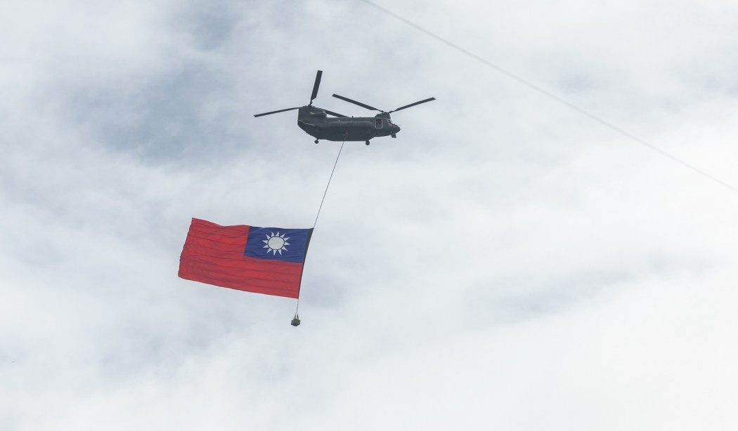 Giant Taiwan flag is flown through the air by a helicopter during celebrations of the National Day in Taipei, Taiwan on October 10, 2021. Photo: Wang Yu Ching/Office of the President, via Flickr CC2.0.