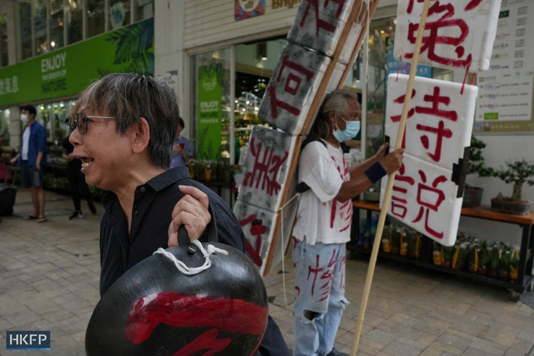 Kate Auyeung (left) and Kowk Kei-Kyun (right) protest against the relocation plan for elderly residents of the Tai Hang Sai Estate on October 13, 2023. Photo: Kyle Lam/HKFP.