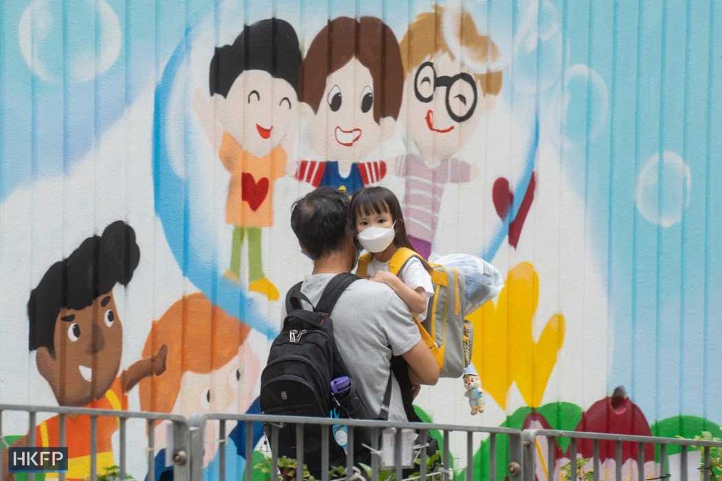 A parent with their child in Hong Kong. File photo: Kyle Lam/HKFP.