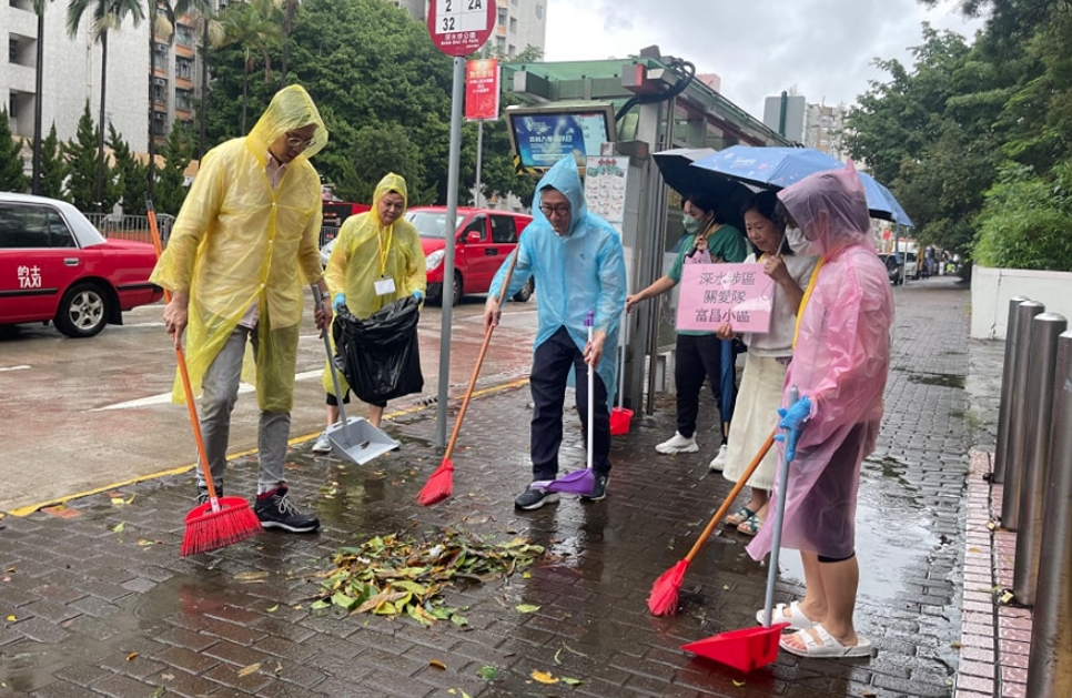 Care Teams in Sham Shui Po sweeping leaves this month in the aftermath of Typhoon Koinu. Photo: Scott Leung, via Facebook.