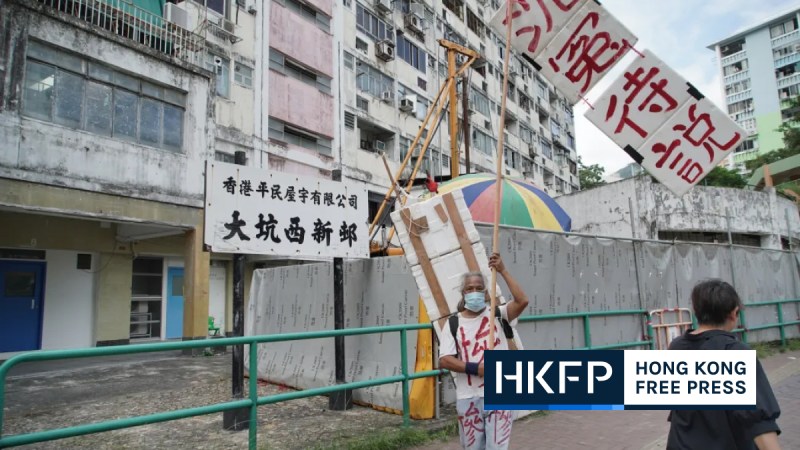 Kwok Kei-Kyun, 64, protests the relocation plan for residents ahead of the redevelopment of Tai Hang Sai Estate, Hong Kong's last private low-rental housing, on October, 13, 2023. Photo: Hans Tse/HKFP.