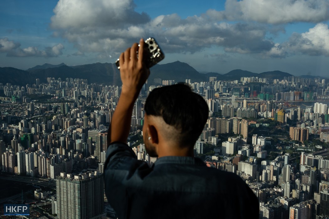 A man looks at the city view of Hong Kong on the observation deck in International Commerce Centre. File photo: Kyle Lam/HKFP.