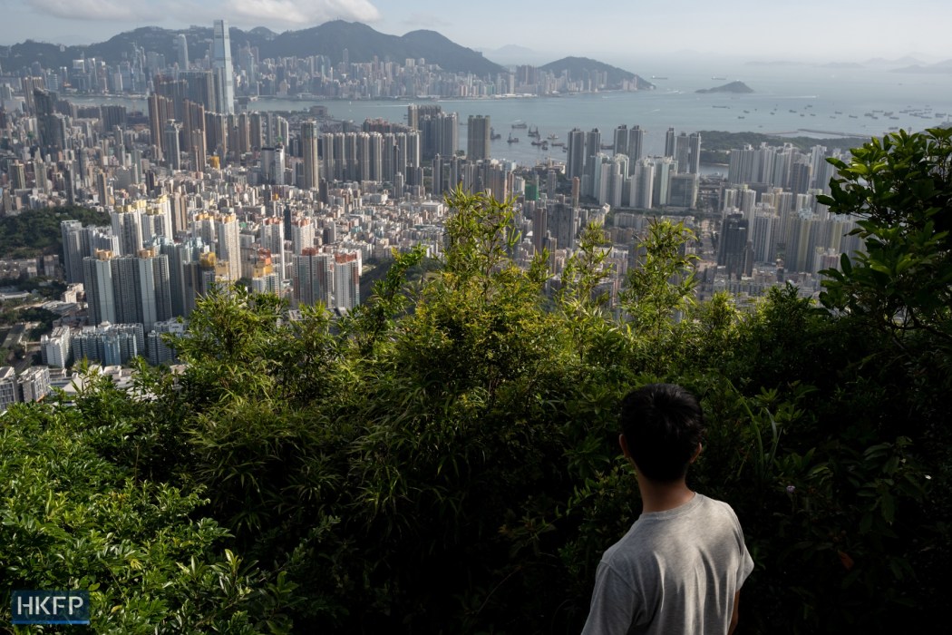 A man looks into the city view of Hong Kong. File photo: Kyle Lam/HKFP.