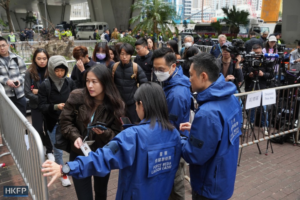 Reporters outside the West Kowloon Law Courts Building on December 18, 2023. Photo: Kyle Lam/HKFP.