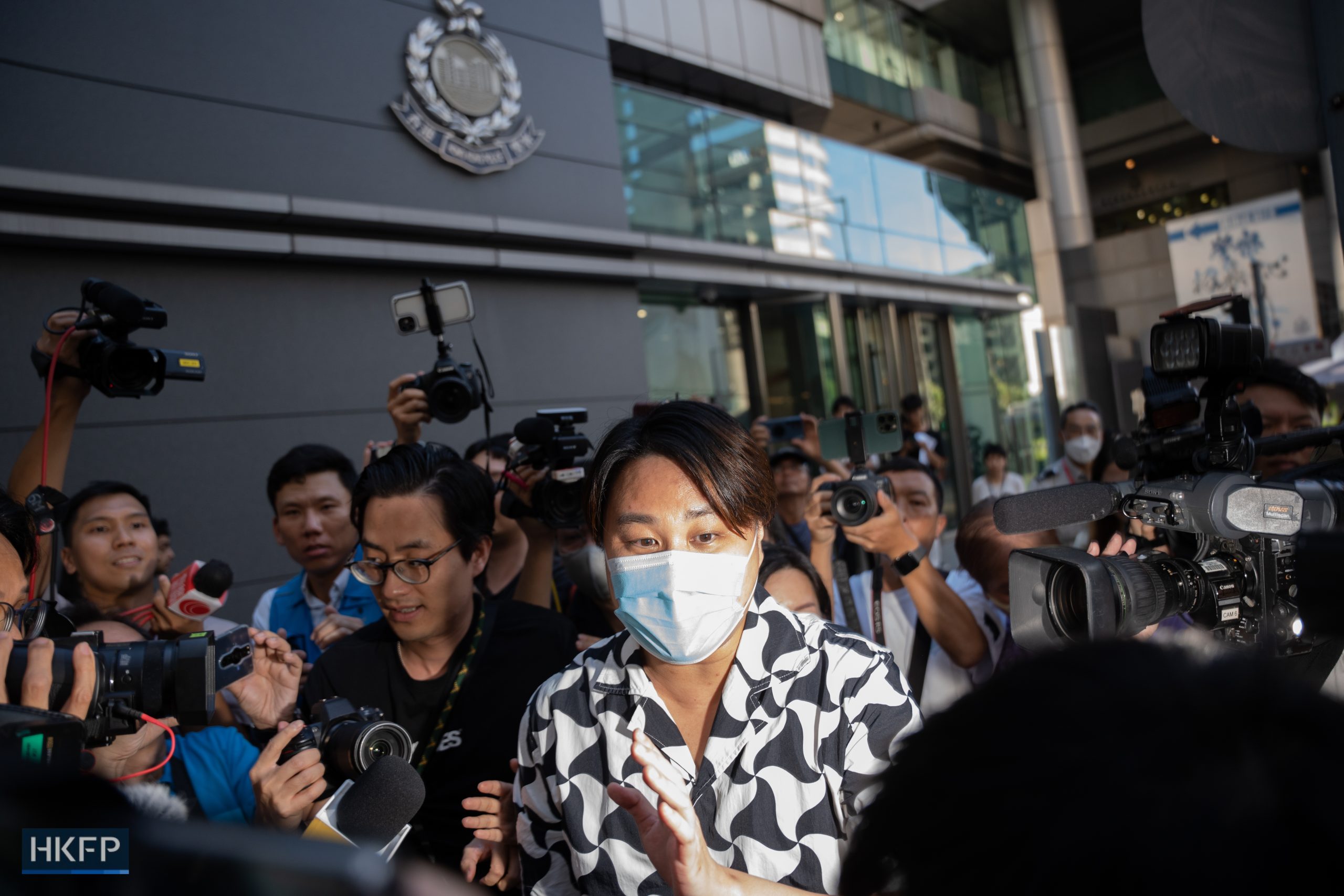 Derek Yuen, son of wanted activist Elmer Yuen, left the police headquarters on Monday, July 24, 2023. Photo: Kyle Lam/HKFP.