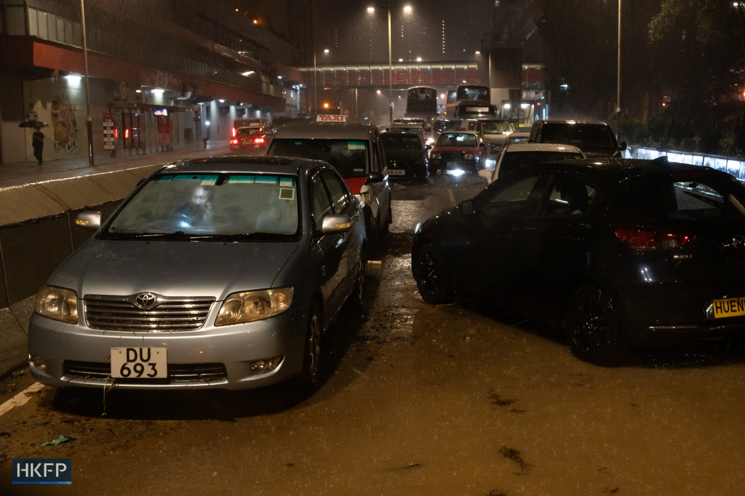 Cars stranded on a road amid downpours during record-breaking rain on Sept. 8, 2023. Photo: Kyle Lam/HKFP.