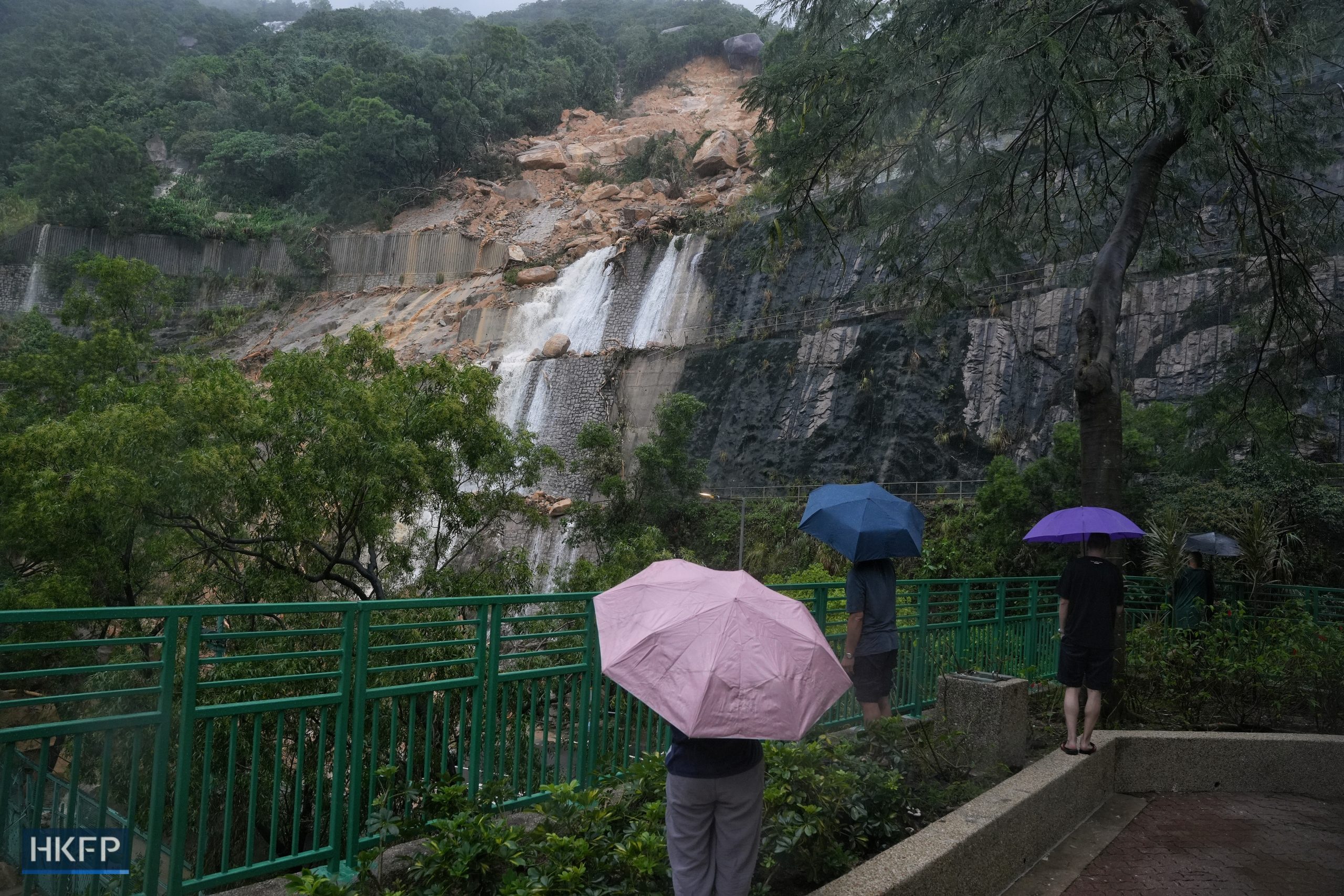 Citizens watching the landslide in Shau Kei Wan during record-breaking rain on Sept, 8, 2023. Photo: Kyle Lam/HKFP