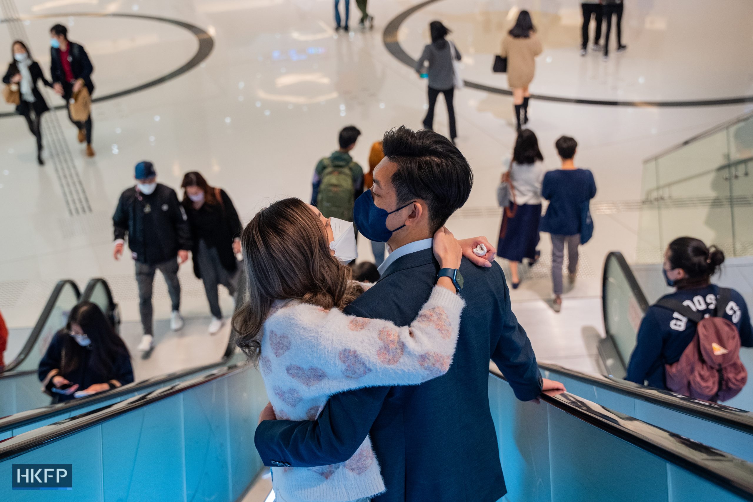 A couple kiss in a shopping mall on February 14, 2023, the valentine’s day. Government lifted the Covid-19 mask mandate on March 1, 2023. Photo: Kyle Lam/HKFP.