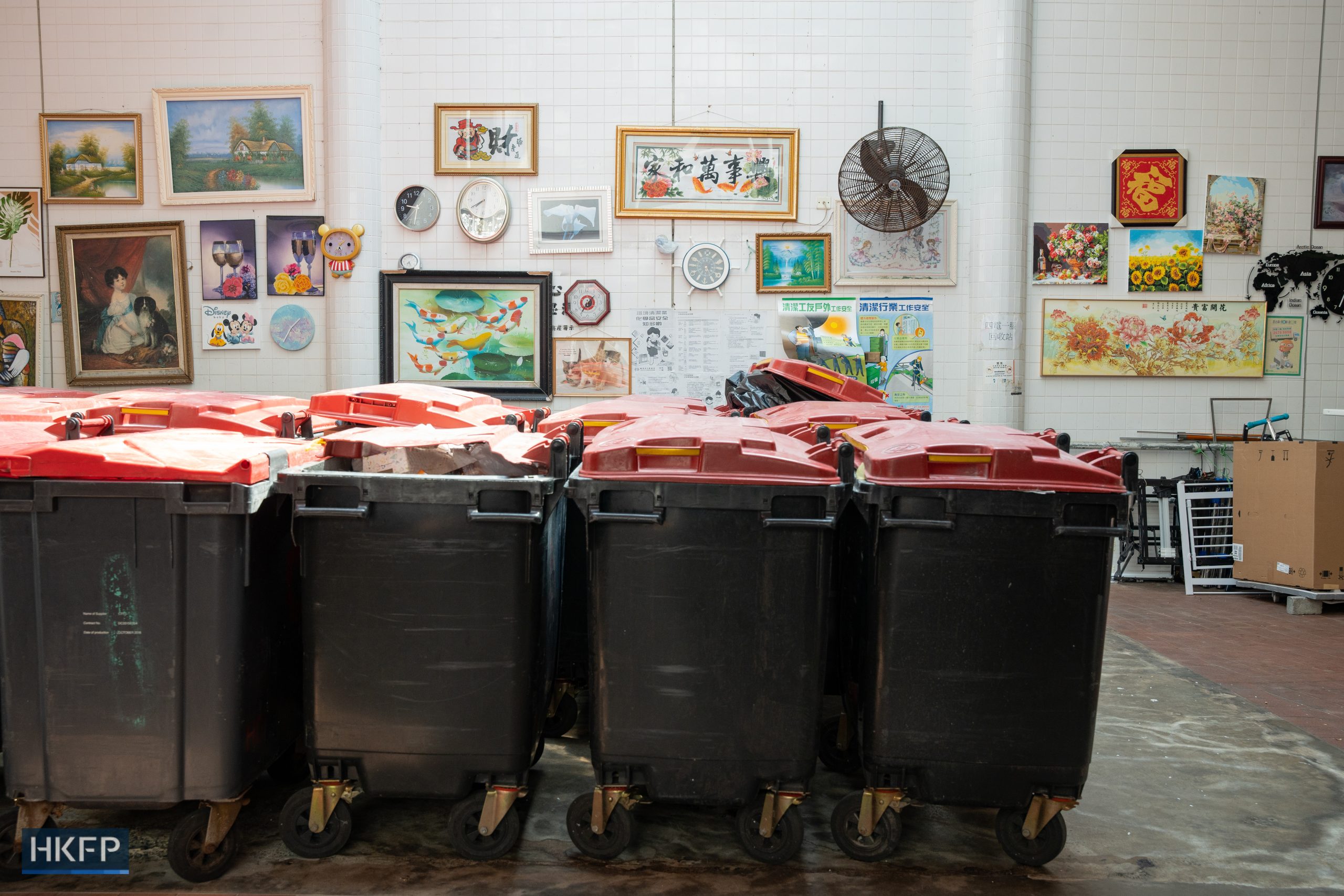 A refuse collection point in Kwai Chung Estate displayed recycled painting and decoration on the wall on March 6, 2023. Cleaners were banned from hanging decorations on the wall after the refuse collection point was reported and became famous. Photo: Kyle Lam/HKFP.