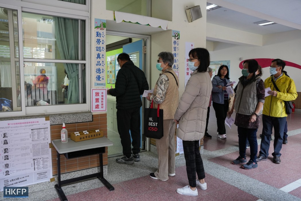People line up to vote at a polling station in Banqiao, New Taipei City, Taiwan, on January 13, 2024. Photo: HKFP.