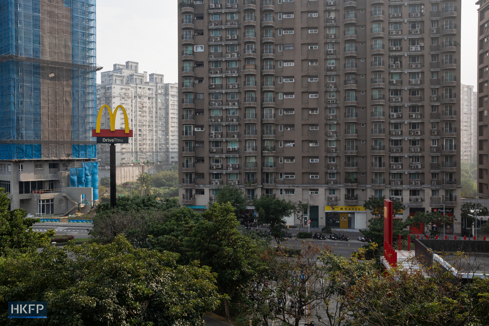 A fast food restaurant advertisement in a residential area in Tamsui, Taiwan, on January 10, 2024. Photo: Kyle Lam/HKFP.