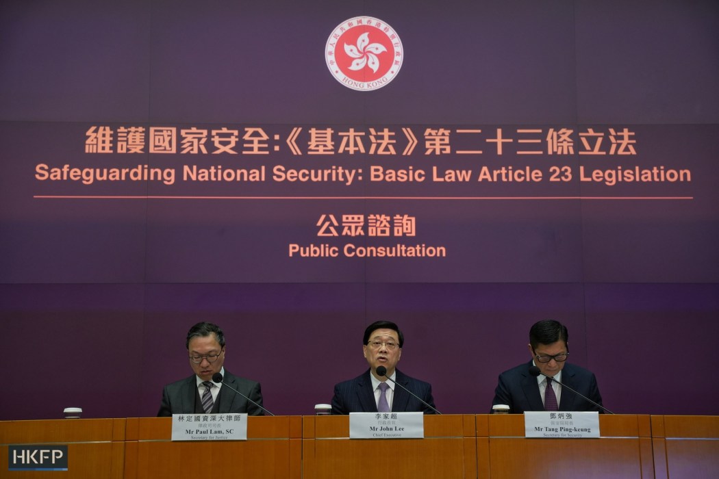 From left: Secretary for Justice Paul Lam, Chief Executive John Lee and Secretary for Security Chris Tang announce the opening of the public consultation period for Hong Kong's homegrown security law, Article 23, on January 30, 2024. Photo: Kyle Lam/HKFP.