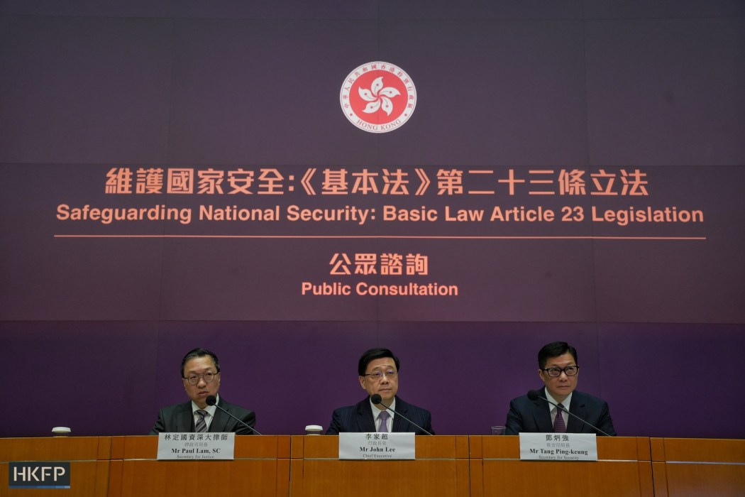 (From left to right) Secretary for Justice Paul Lam, Chief Executive John Lee and Secretary for Security Chris Tang announce the opening of the public consultation period for Hong Kong's homegrown security law, Article 23, on January 30, 2024. Photo: Kyle Lam/HKFP.