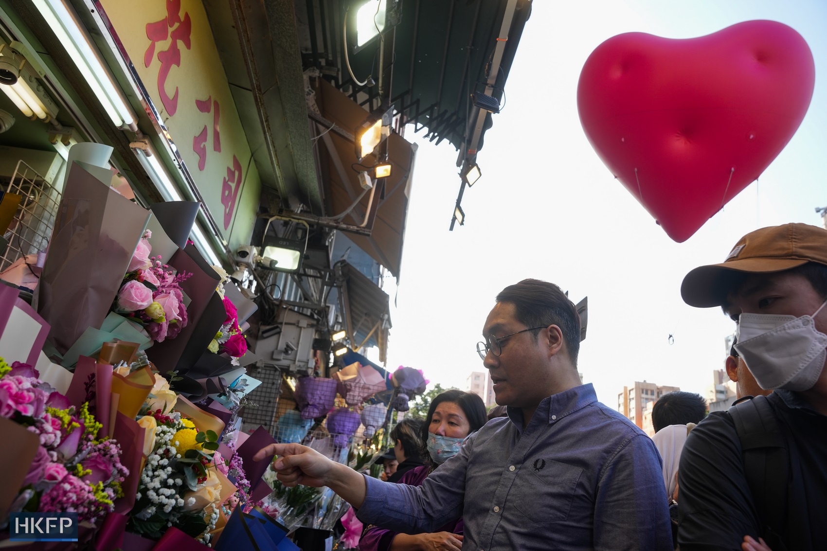 A Chubby Hearts balloon pops up at the Flower Market in Mong Kok on February 14, 2024. Photo: Kyle Lam/HKFP.