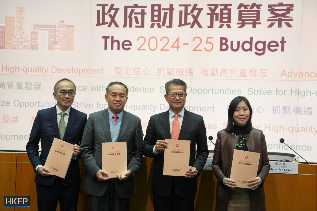Finance Secretary Paul Chan (second from right) meets the press after delivering the budget for 2024 on February 28, 2024.