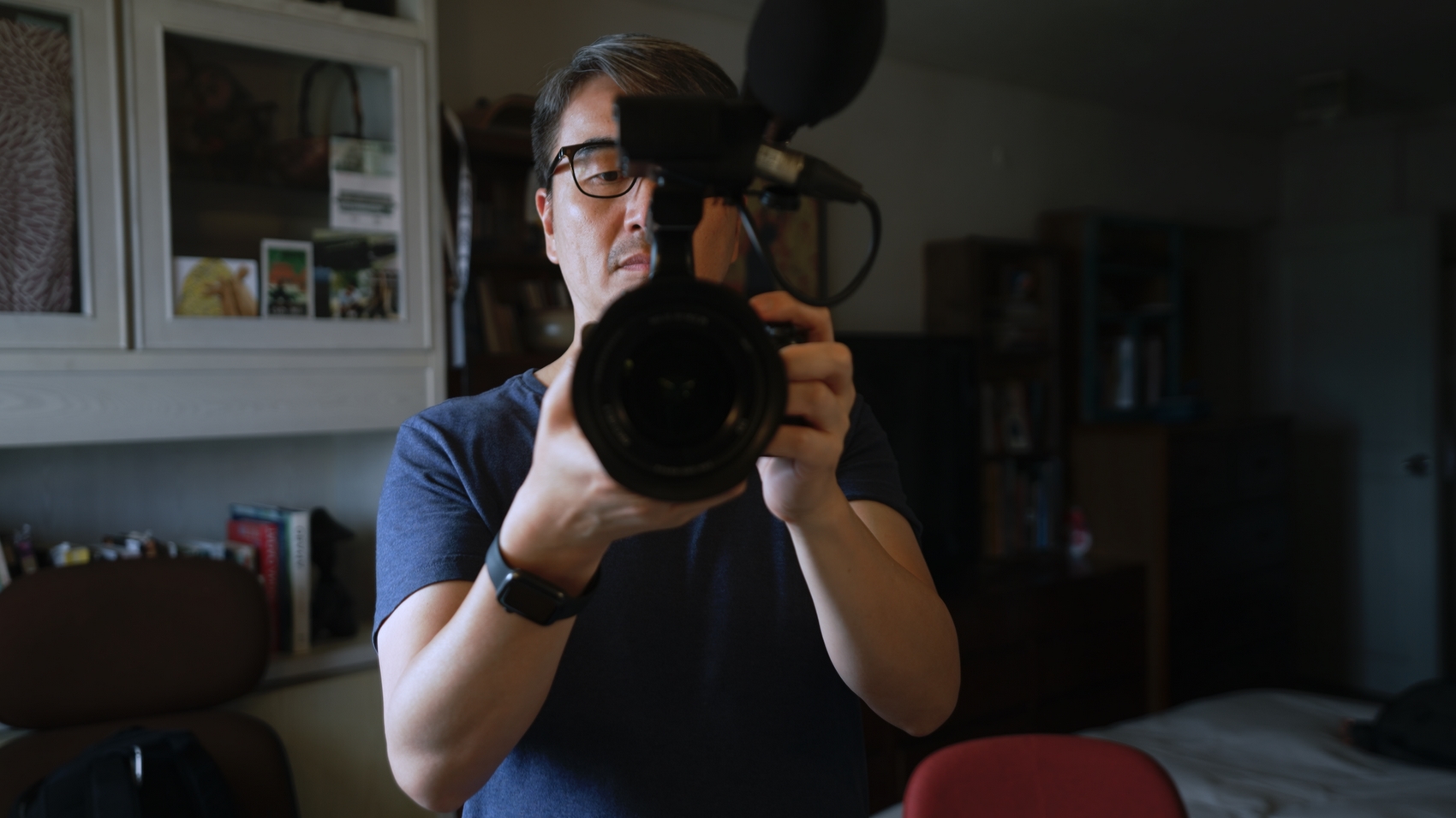 Director S. Leo Chiang taking a shot of himself in the mirror in his apartment in Taipei, Taiwan. Photo: Island in Between