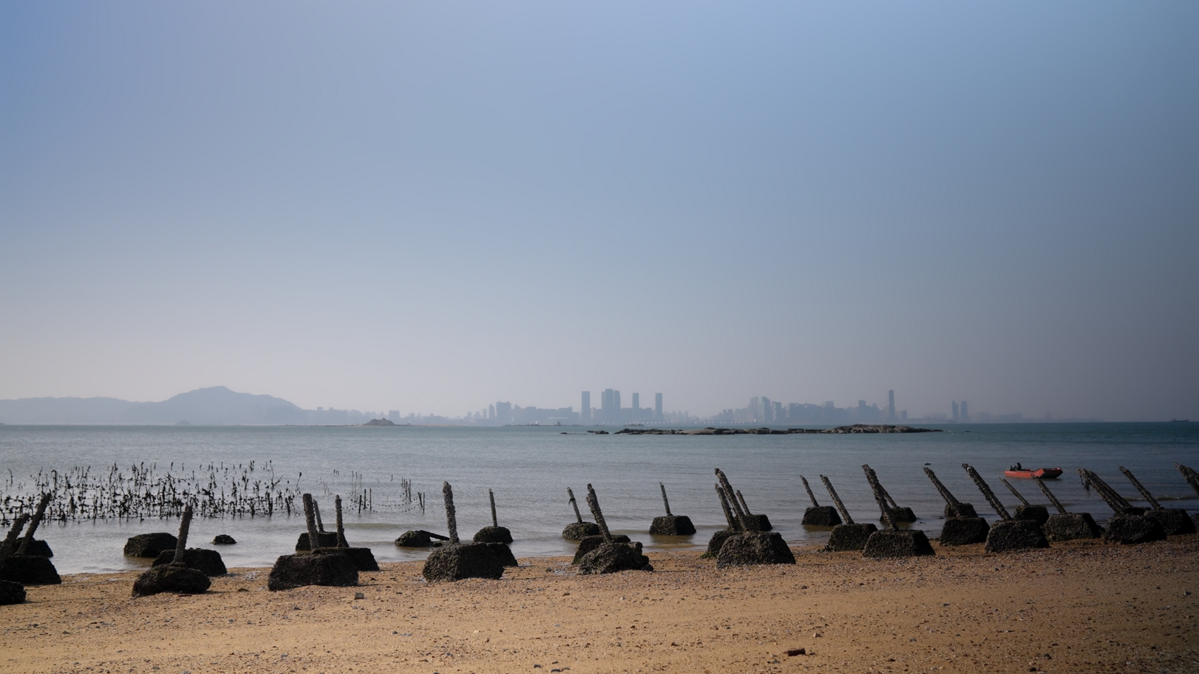 A view of the high-rises in Xiamen City, China, from Little Kinmen Island. The spikes in the foreground are anti-landing spikes setup in the 1950s and 1960s by the Taiwanese military to deter Chinese military vessels from landing in Kinmen. Photo: Island in Between