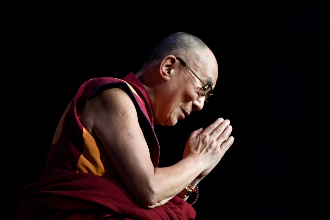 The Dalai Lama gestures during a group hearing at the Palais des Congres in Paris on September 13, 2016. Photo: Eric Feferberg/AFP.