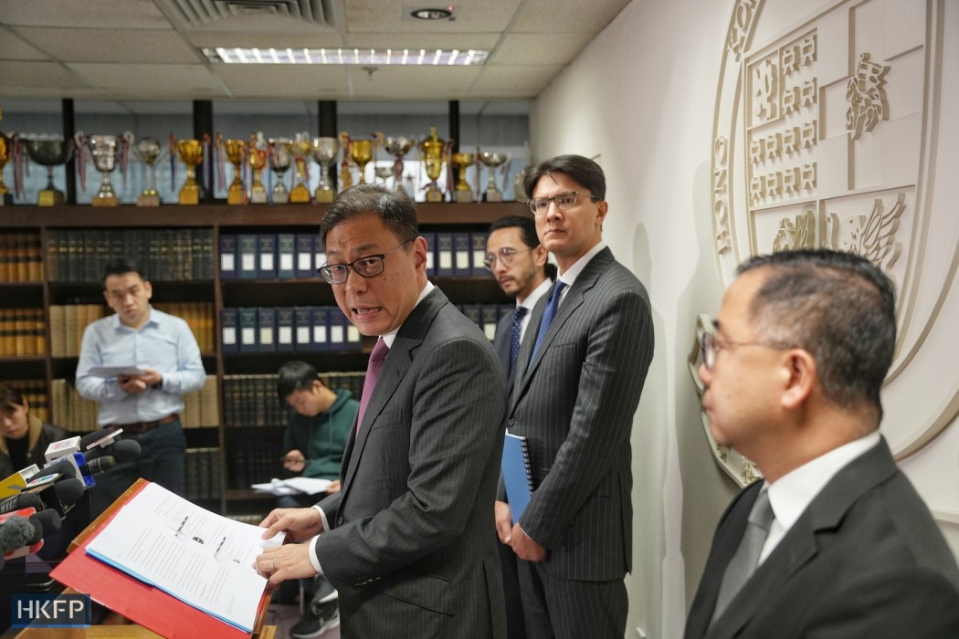 The Chairperson of the Hong Kong Bar Association Victor Dawes (centre) meets the press on February 29, 2024.