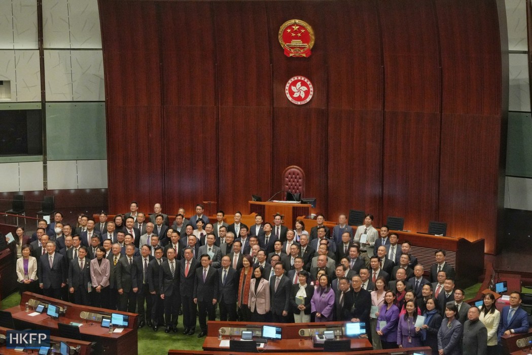 Hong Kong lawmakers gather for a group photo after the passing of Article 23, the city's new security law, on March 19, 2024.