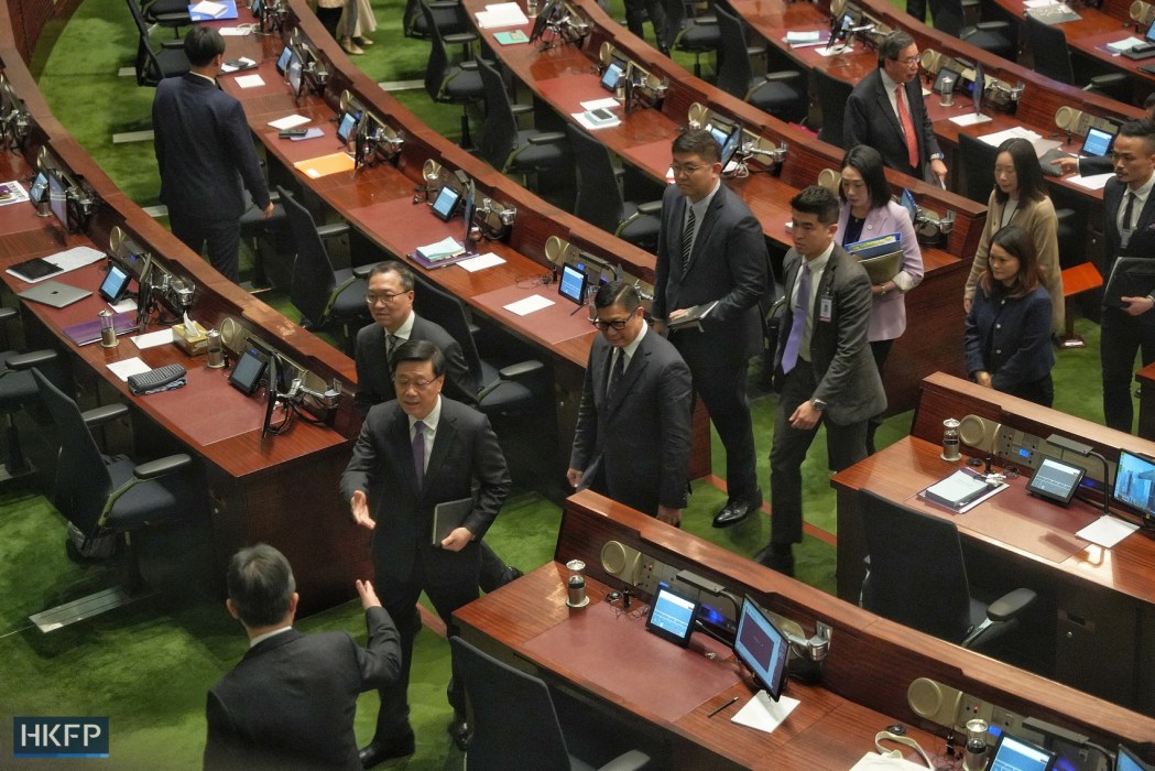 Hong Kong officials including Chief Executive John Lee and Secretary for Security Chris Tang leave the Legislative Council chamber after the passing of Article 23 on March 19, 2024. Photo: Kyle Lam/HKFP.