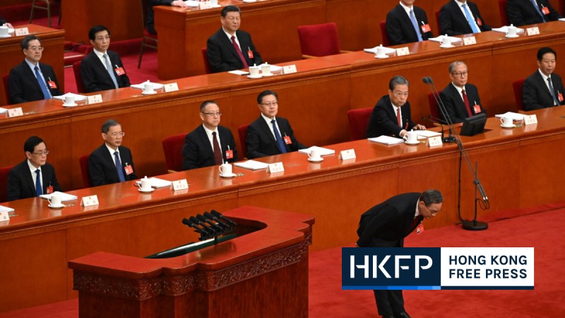 China's Premier Li Qiang bows before delivering his work report at the opening session of the National People's Congress (NPC) at the Great Hall of the People in Beijing on March 5, 2024. Photo by Greg Baker/AFP.