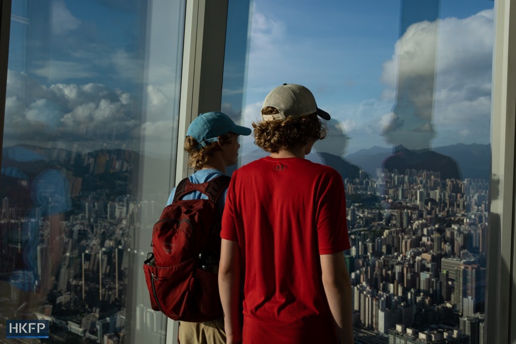 Youngsters look at the view of Hong Kong, on July 6, 2023. Photo: Kyle Lam/HKFP. 