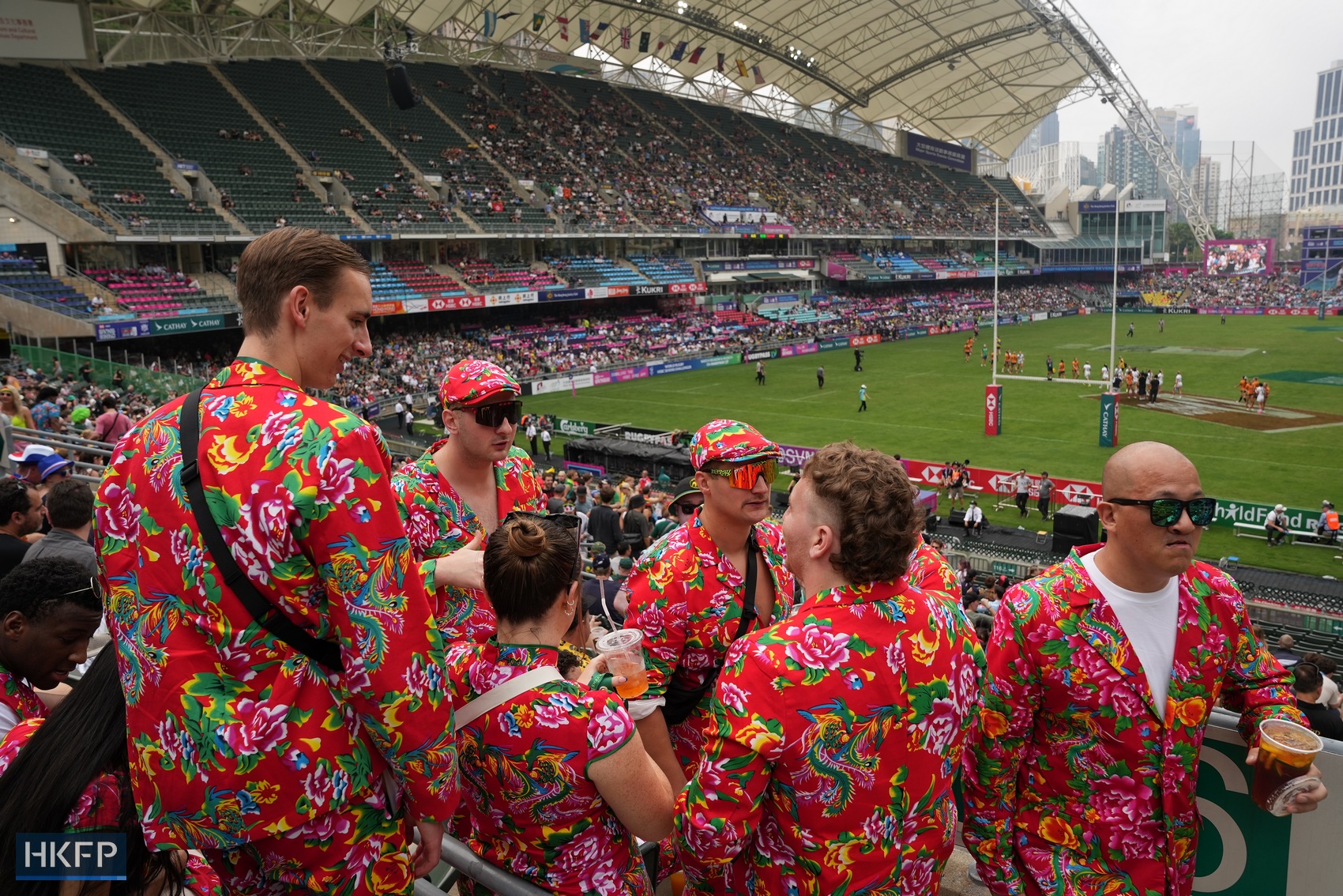 Fans in colourful outfits at the Hong Kong Sevens, in Causeway Bay's Hong Kong Stadium, on April 5, 2024. Photo: Kyle Lam/HKFP. 