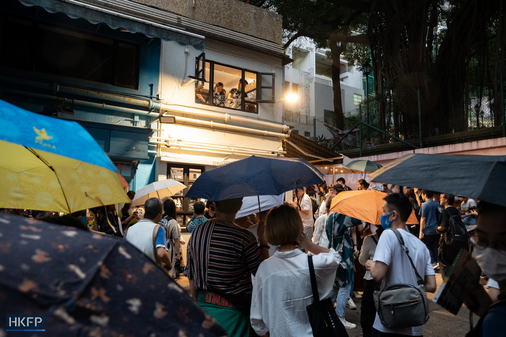 Supporters for Hong Kong independent bookstore Mount Zero linger outside the shop despite a humid weather and a drizzle in the evening on March 31, 2024. Photo: Kyle Lam/HKFP.