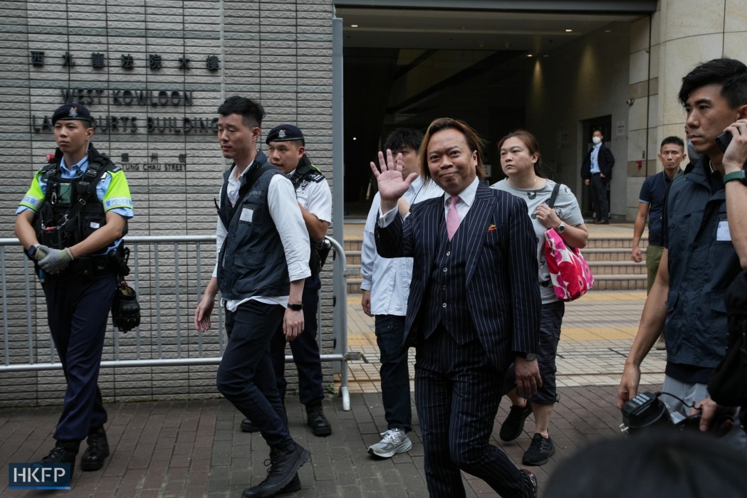 Barrister Lawrence Lau waves his hands outside the West Kowloon Law Courts Building after Hong Kong’s Department of Justice announced it intends to appeal his acquittal, on May 30, 2024.